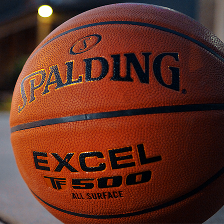 Close up image of the Excel TF-500 basketball on a driveway.